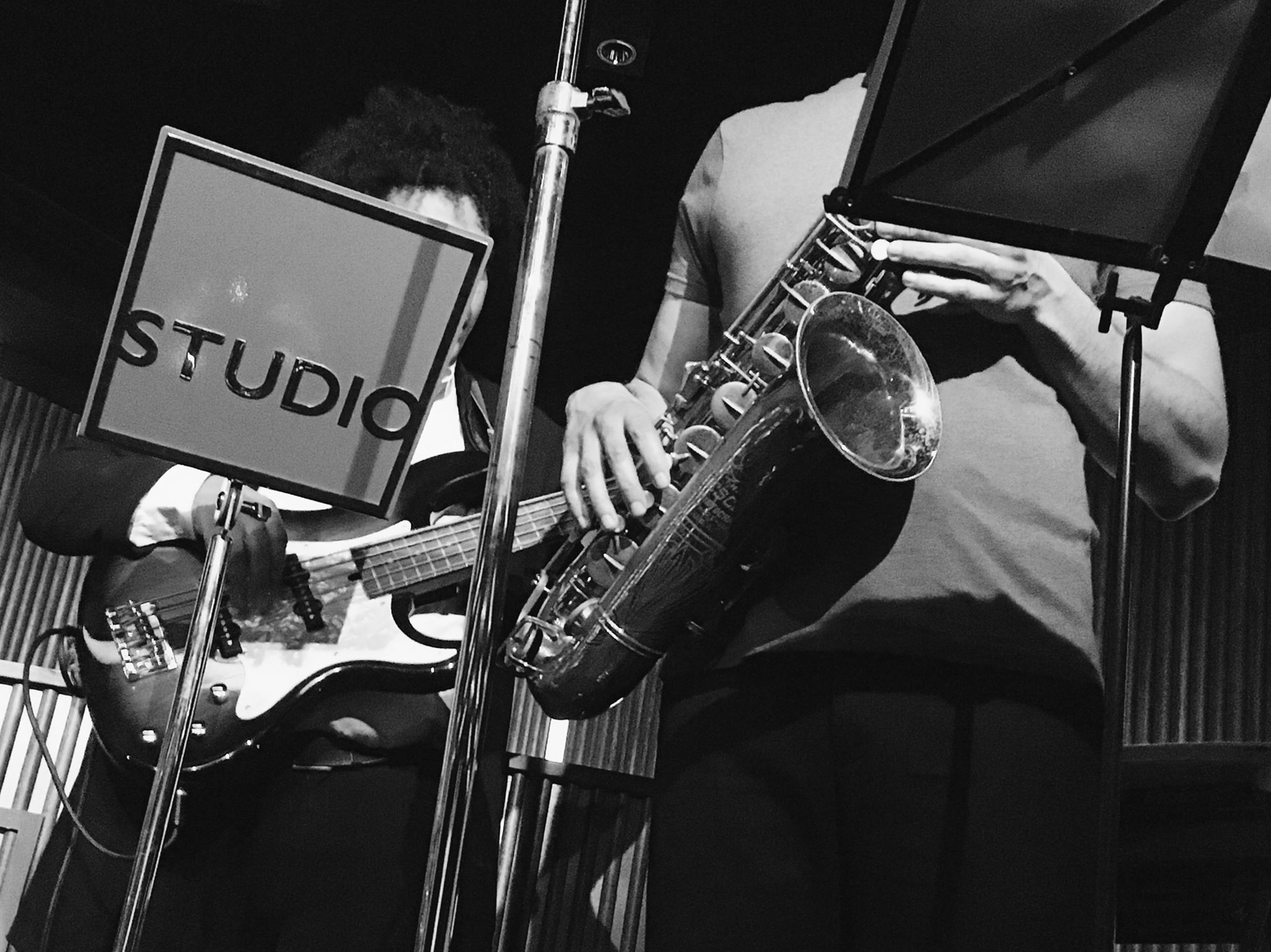 Jazz performace showing the player next to the branding master logo music stand
